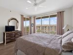 Master bedroom - King bed, pool views, balcony access